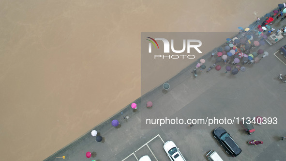 Floodwaters are passing through the Rongan county section of the Rongjiang River in the upper reaches of the Pearl River in Liuzhou, Guangxi...