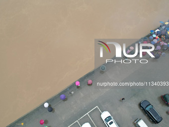 Floodwaters are passing through the Rongan county section of the Rongjiang River in the upper reaches of the Pearl River in Liuzhou, Guangxi...