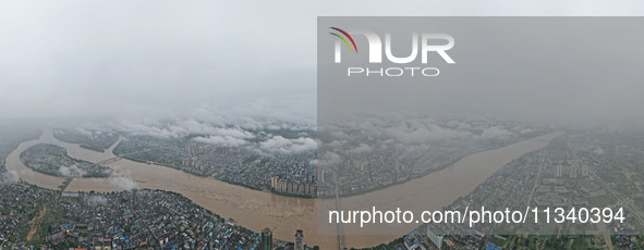 Floodwaters are passing through the Rongan county section of the Rongjiang River in the upper reaches of the Pearl River in Liuzhou, Guangxi...