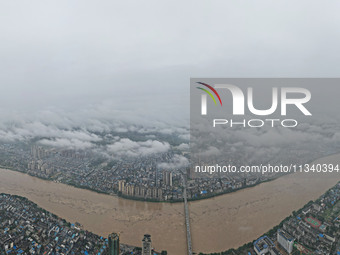 Floodwaters are passing through the Rongan county section of the Rongjiang River in the upper reaches of the Pearl River in Liuzhou, Guangxi...