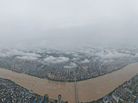 Floodwaters are passing through the Rongan county section of the Rongjiang River in the upper reaches of the Pearl River in Liuzhou, Guangxi...