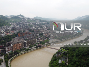 Water level is rising in the Maotai Township section of the Chishui River due to heavy rainfall in Renhuai, China, on June 18, 2024. (