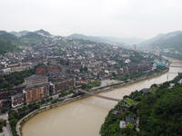 Water level is rising in the Maotai Township section of the Chishui River due to heavy rainfall in Renhuai, China, on June 18, 2024. (