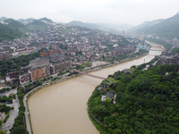 Water level is rising in the Maotai Township section of the Chishui River due to heavy rainfall in Renhuai, China, on June 18, 2024. (