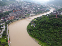 Water level is rising in the Maotai Township section of the Chishui River due to heavy rainfall in Renhuai, China, on June 18, 2024. (