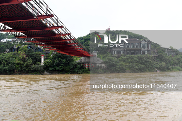 Water level is rising in the Maotai Township section of the Chishui River due to heavy rainfall in Renhuai, China, on June 18, 2024. 