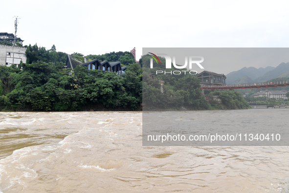 Water level is rising in the Maotai Township section of the Chishui River due to heavy rainfall in Renhuai, China, on June 18, 2024. 