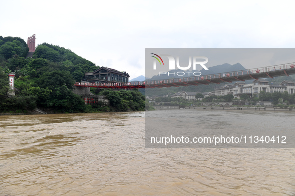 Water level is rising in the Maotai Township section of the Chishui River due to heavy rainfall in Renhuai, China, on June 18, 2024. 