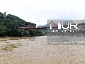 Water level is rising in the Maotai Township section of the Chishui River due to heavy rainfall in Renhuai, China, on June 18, 2024. (