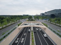 Vehicles are passing through the Wenyi West Road tunnel in Hangzhou, China, on June 18, 2024. (