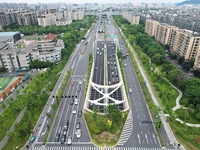 Vehicles are passing through the Wenyi West Road tunnel in Hangzhou, China, on June 18, 2024. (