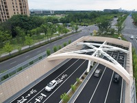 Vehicles are passing through the Wenyi West Road tunnel in Hangzhou, China, on June 18, 2024. (