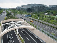 Vehicles are passing through the Wenyi West Road tunnel in Hangzhou, China, on June 18, 2024. (