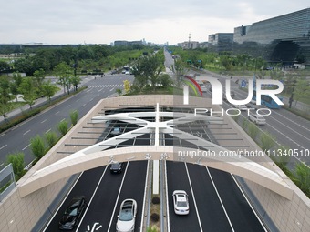 Vehicles are passing through the Wenyi West Road tunnel in Hangzhou, China, on June 18, 2024. (