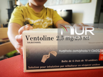 A child is holding a box of Ventolin in Paris, France, on June 18, 2024. Since the beginning of the month, Ventolin is in short supply in ma...