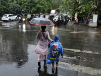 A pedestrian is carrying an umbrella during rainfall in Mumbai, India, on June 18, 2024. (