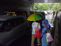 A pedestrian is carrying an umbrella during rainfall in Mumbai, India, on June 18, 2024. (