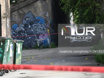 Shell casings are lying in an alley where the victim is being shot. A 48-year-old male is in critical condition after being shot in an alley...