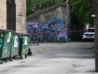 Shell casings are lying in an alley where the victim is being shot. A 48-year-old male is in critical condition after being shot in an alley...