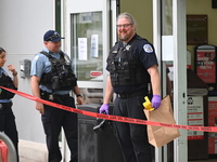 The police are taking out evidence bags at Jewel Osco where the victim who was shot is walking in for help. A 48-year-old male is in critica...