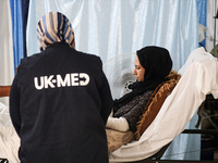 An injured person is lying inside the UK-Med hospital in southern Gaza, which is being set up to try to meet what it describes as an ''overw...