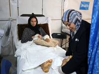 An injured person is lying inside the UK-Med hospital in southern Gaza, which is being set up to try to meet what it describes as an ''overw...