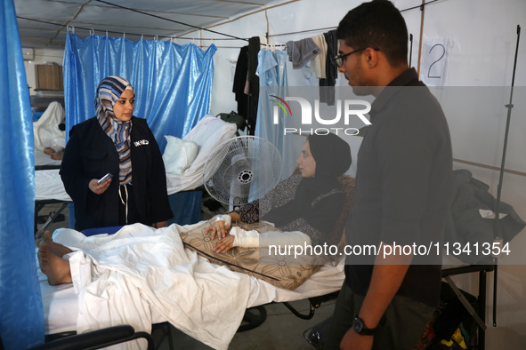 An injured person is lying inside the UK-Med hospital in southern Gaza, which is being set up to try to meet what it describes as an ''overw...