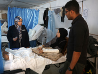 An injured person is lying inside the UK-Med hospital in southern Gaza, which is being set up to try to meet what it describes as an ''overw...