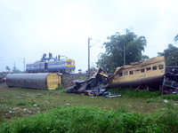 Railway staff, workers, and police force are being seen at the site as they are restoring the train service at the tracks after a collision...