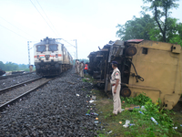 Railway staff, workers, and police force are being seen at the site as they are restoring the train service at the tracks after a collision...