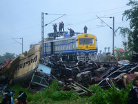 Railway staff, workers, and police force are being seen at the site as they are restoring the train service at the tracks after a collision...