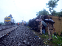 Railway staff, workers, and police force are being seen at the site as they are restoring the train service at the tracks after a collision...