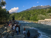 Visitors are touring near the Barwalla waterfall in Kangan, about 70kms from Srinagar, on June 18, 2024. (