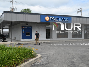 FBI agents are responding to PNC Bank in Chicago, Illinois, because of a bank robbery. Two suspects are being captured, and money and a hand...