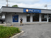 FBI agents are responding to PNC Bank in Chicago, Illinois, because of a bank robbery. Two suspects are being captured, and money and a hand...