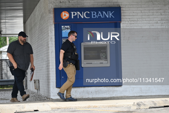 FBI agents are responding to PNC Bank because of a bank robbery in Chicago, Illinois. Two suspects are being captured, and money and a handg...