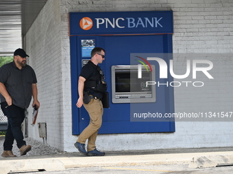 FBI agents are responding to PNC Bank because of a bank robbery in Chicago, Illinois. Two suspects are being captured, and money and a handg...