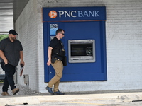 FBI agents are responding to PNC Bank because of a bank robbery in Chicago, Illinois. Two suspects are being captured, and money and a handg...