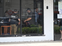 FBI agents are responding to PNC Bank because of a bank robbery in Chicago, Illinois. Two suspects are being captured, and money and a handg...