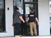 FBI agents are responding to PNC Bank because of a bank robbery in Chicago, Illinois. Two suspects are being captured, and money and a handg...