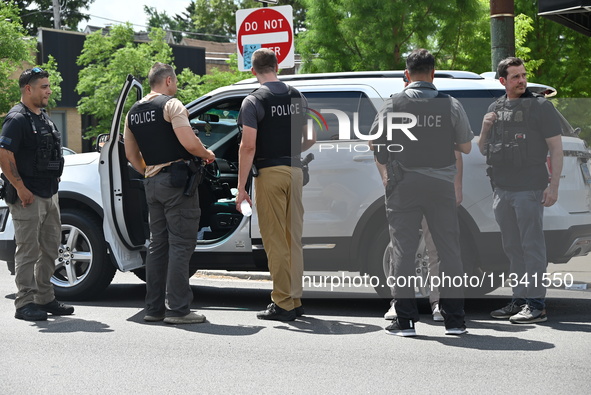 FBI agents and Chicago Police are on the scene on W. Belmont Av. where the vehicles are being recovered, with one vehicle containing a black...