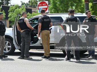 FBI agents and Chicago Police are on the scene on W. Belmont Av. where the vehicles are being recovered, with one vehicle containing a black...