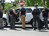 FBI agents and Chicago Police are on the scene on W. Belmont Av. where the vehicles are being recovered, with one vehicle containing a black...