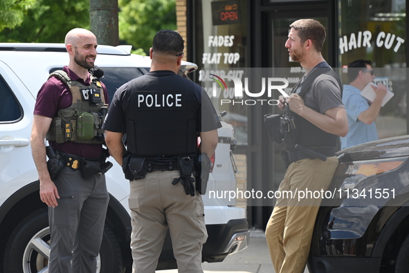 FBI agents and Chicago Police are on the scene on W. Belmont Av. where the vehicles are being recovered, with one vehicle containing a black...