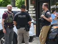 FBI agents and Chicago Police are on the scene on W. Belmont Av. where the vehicles are being recovered, with one vehicle containing a black...