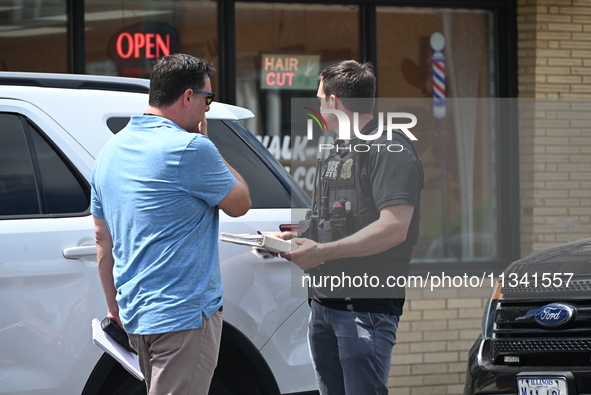 FBI agents and Chicago Police are responding to the scene on W. Belmont Ave. where two vehicles are being recovered that were used in the ba...