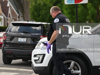 The Crime Scene Unit is recovering a handgun from a vehicle used in the bank robbery. Two suspects are being captured, and money and a handg...