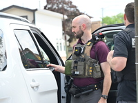 An FBI agent is at the scene on W. Belmont Ave. where two vehicles are being recovered that were used in the bank robbery. Two suspects are...