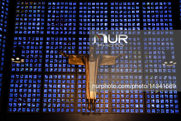 A statue of Jesus Christ is standing inside the Kaiser Wilhelm Memorial Church in Berlin, Germany, on June 18, 2024. 