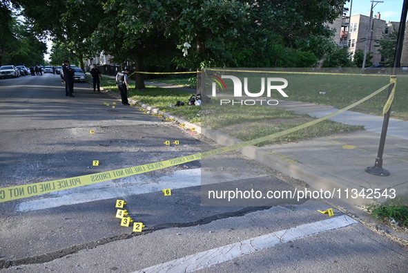 Shell casings are being located at the crime scene on Tuesday afternoon. Two men are in serious condition after being shot in Chicago, Illin...